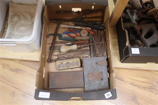 A collection of carpentry and bookbinding tools